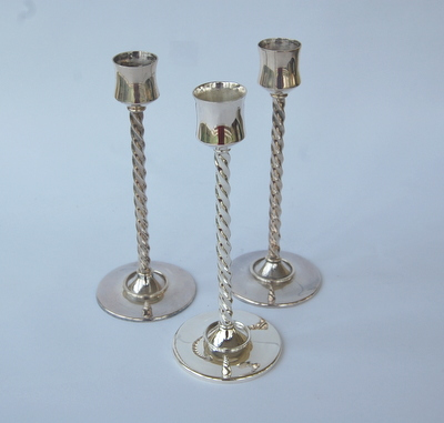 Vintage set of three silver candlesticks