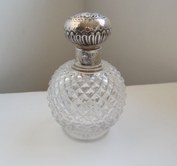 Victorian perfume flask with silver collar and cap